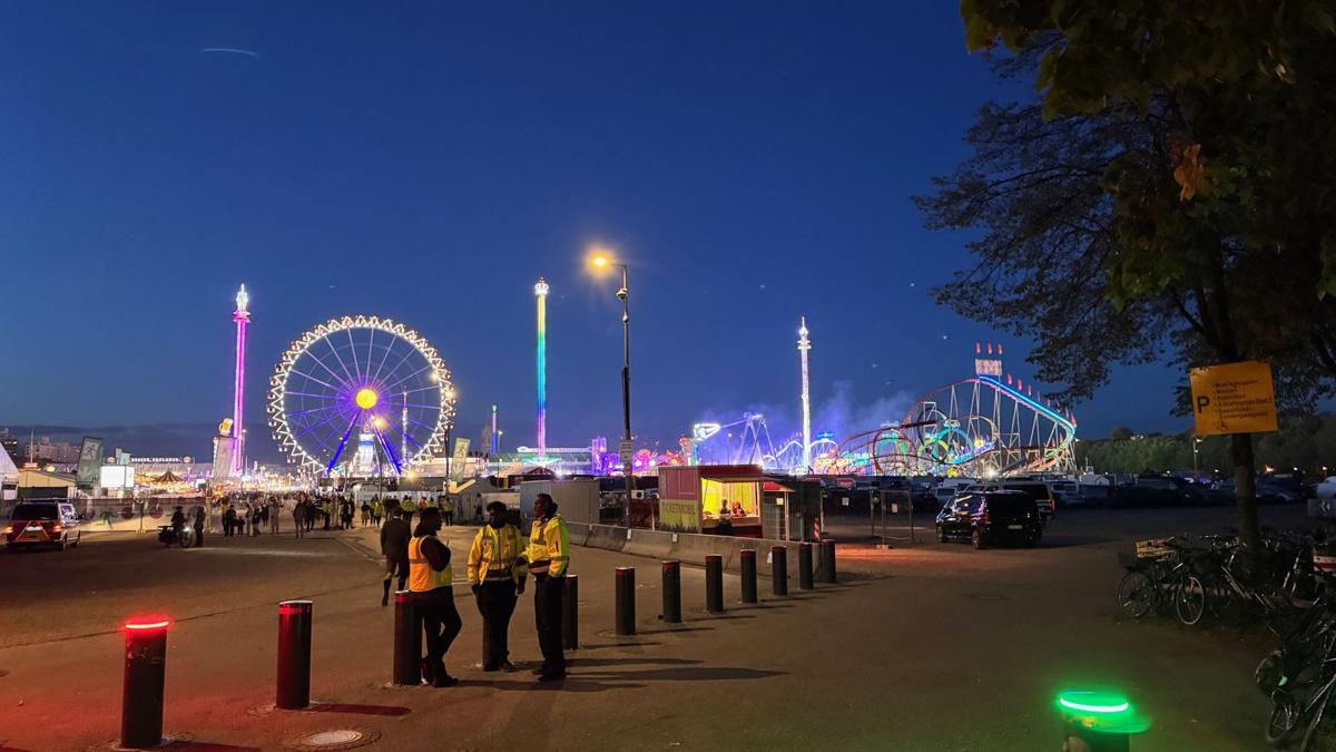 The Wiesn lights up at dusk.